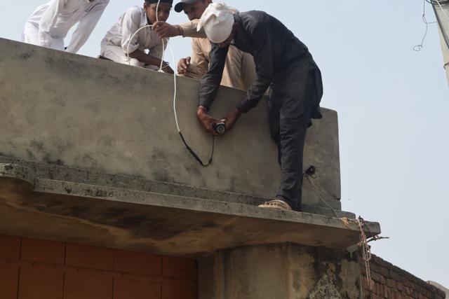 Closed-circuit television (CCTV) cameras being installed on a street leading to the gurdwara in Burj Jawahar Singh Wala village in Faridkot district on Wednesday. (Amit R Joshi/HT Photo)