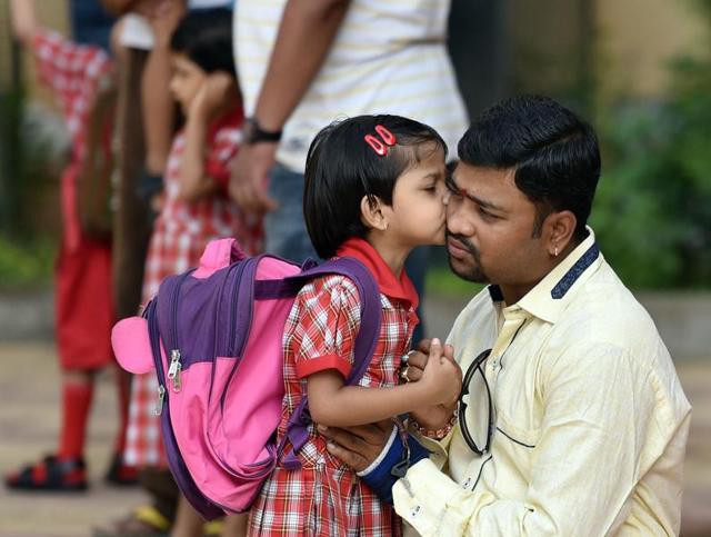 Not without my daddy is this child’s motto. (PRATHAM GOKHALE) 