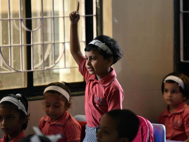 This kid seems excited to tell her class about her summer vacation trip. (PRATHAM GOKHALE) 