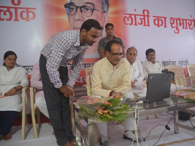 Chief minister Shivraj Singh Chouhan interacts with village sarpanchs through video-conferencing at Karanja village in Balaghat district on Tuesday. (HT photo) Chief minister Shivraj Singh Chouhan interacts with village sarpanchs through video-conferencing at Karanja village in Balaghat district on Tuesday. (HT photo)