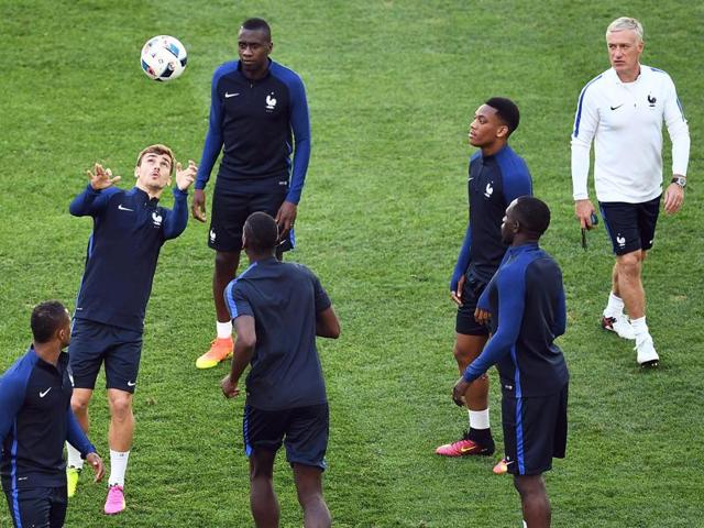 France's coach Didier Deschamps (in white) watches his players during a training session at the Velodrome stadium in Marseille, on June 14, 2016, on the eve of the match against Albania. (AFP) France's coach Didier Deschamps (in white) watches his players during a training session at the Velodrome stadium in Marseille, on June 14, 2016, on the eve of the match against Albania. (AFP)