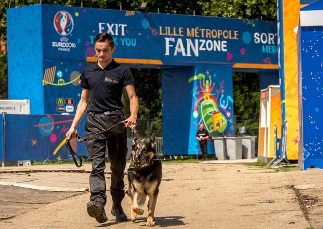 A security agent walks in the fan zone during its inauguration in Lille, northern France. (AFP Photo) A security agent walks in the fan zone during its inauguration in Lille, northern France. (AFP Photo)