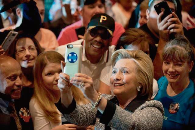 Presumptive Democratic nominee for president Hillary Clinton greets supporters at the International Brotherhood of Electric Workers Hall on Tuesday. (AFP) Presumptive Democratic nominee for president Hillary Clinton greets supporters at the International Brotherhood of Electric Workers Hall on Tuesday. (AFP)
