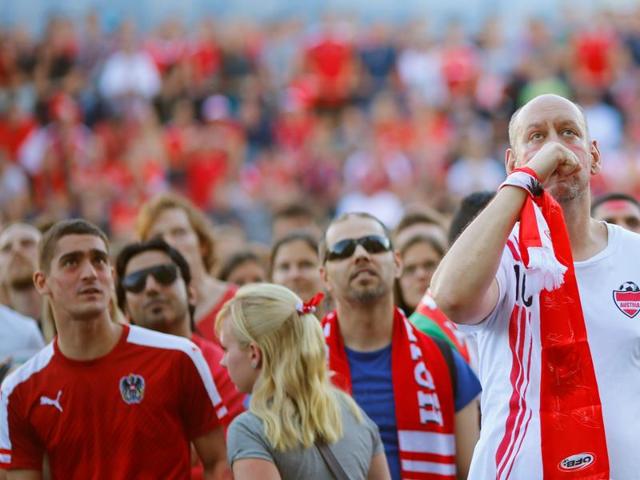 Austria’s fans react as they watch the Euro 2016 match against Hungary at a public screening in Vienna. (Reuters Photo) Austria’s fans react as they watch the Euro 2016 match against Hungary at a public screening in Vienna. (Reuters Photo)