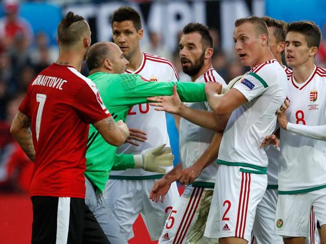 Hungary goalkeeper Gabor Kiraly (2nd left) pushes his teammates away from Austria's Marko Arnautovic as they argue during the Euro 2016 Group F football match. (AP Photo) Hungary goalkeeper Gabor Kiraly (2nd left) pushes his teammates away from Austria's Marko Arnautovic as they argue during the Euro 2016 Group F football match. (AP Photo)