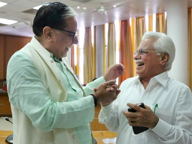 BJP backed candidate for Rajya Sabha, Zee Media chairman Subhash Chandra and Indian National Lok Dal and Congress backed candidate for Rajya Sabha RK Anand, during polling in Chandigarh.(PTI File Photo)