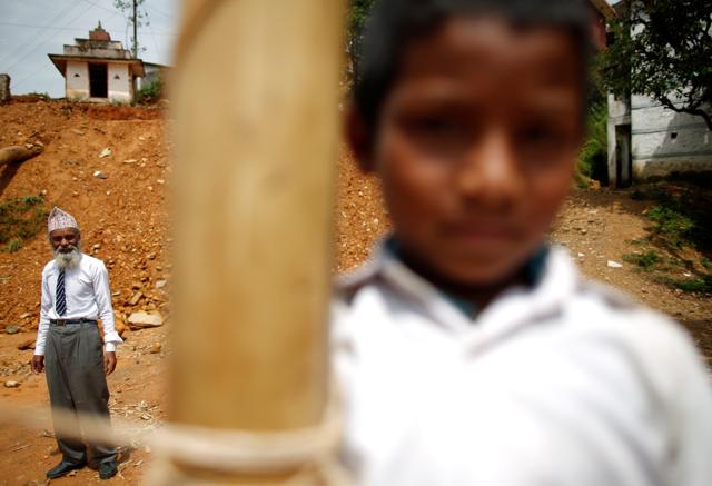 Durga Kami poses for a picture during a volleyball match at Shree Kala Bhairab Higher Secondary School. (REUTERS)