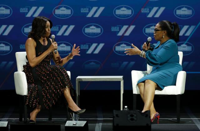 US First lady Michelle Obama (L) speaks with Oprah Winfrey on a stage at the White House Summit on the United State of Women in Washington, DC on June 14, 2016. / AFP PHOTO / YURI GRIPAS  (AFP)