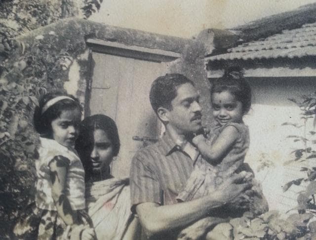 Sudha Menon, aged 3, with her father in a family photo that also shows her mother and sister.(Photo courtesy Sudha Menon)