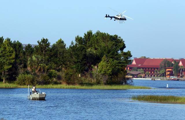 Florida Fish and Wildlife and an Orange County Sheriffs helicopter search for the kid early on Wednesday. (AP) Florida Fish and Wildlife and an Orange County Sheriffs helicopter search for the kid early on Wednesday. (AP)