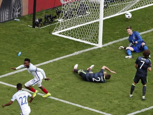 Sturridge, second from left, reacts after his shot found the back of the net. (AP)