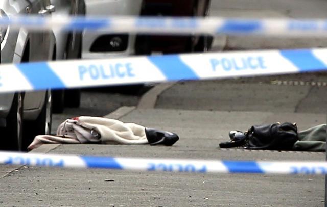Items on the ground at the scene after Labour Member of Parilament Jo Cox was shot and injured in an attack, in Birstall, West Yorkshire, England, Thursday. (AP Photo) Items on the ground at the scene after Labour Member of Parilament Jo Cox was shot and injured in an attack, in Birstall, West Yorkshire, England, Thursday. (AP Photo)