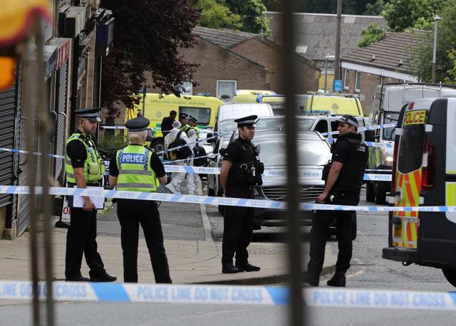 Police at the scene after Batley and Spen Member of Parliament Jo Cox was shot, in Birstall, West Yorkshire. (AP) Police at the scene after Batley and Spen Member of Parliament Jo Cox was shot, in Birstall, West Yorkshire. (AP)