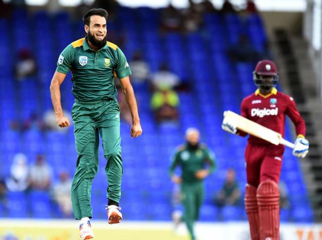 South African cricketer Imran Tahir (left) celebrates dismissing West Indies batsman Andre Fletcher during the 6th One Day International match of the Tri-nation Series between West Indies and South Africa at the Warner Park stadium in Basseterre, Saint Kitts.(AFP Photo)