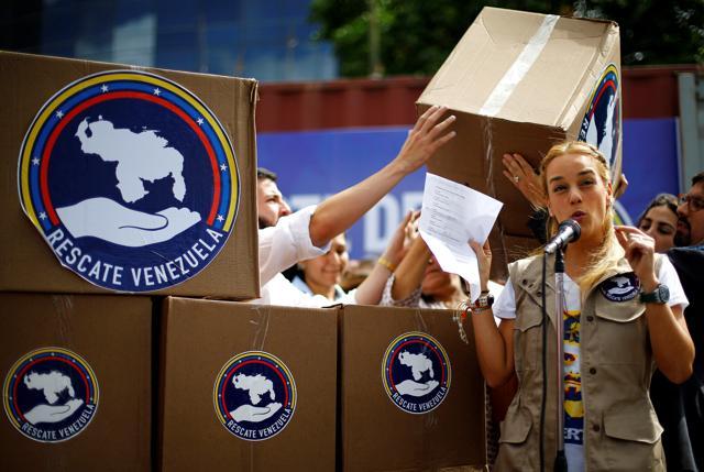 Lilian Tintori (C), wife of Venezuelan jailed opposition leader Leopoldo Lopez, delivers a press conference to support a donation campaign of medical supplies and diapers in Caracas on Wednesday. (REUTERS)