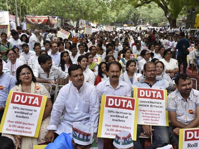 The teachers are protesting against the UGC Gazette Notification (3rd Amendment), which would have increased the workload and let to retrenchment of ad-hoc teachers. (Mohd Zakir/HT) The teachers are protesting against the UGC Gazette Notification (3rd Amendment), which would have increased the workload and let to retrenchment of ad-hoc teachers. (Mohd Zakir/HT)