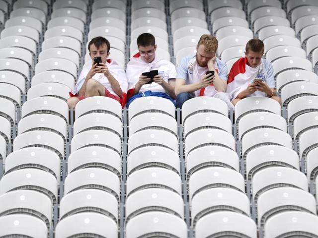England fans use their phones inside the Lens stadium ahead of the England vs Wales Euro 2016 match.  (Reuters Photo) 
