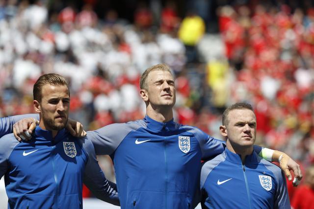 England's Harry Kane, Joe Hart and Wayne Rooney during the national anthem before the game. (Reuters Photo) England's Harry Kane, Joe Hart and Wayne Rooney during the national anthem before the game. (Reuters Photo)