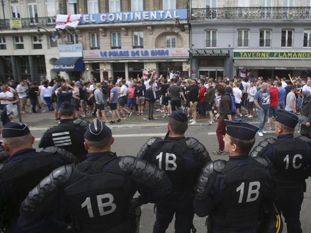 French police watch England fans outside a bar in downtown Lille. (AP Photo) French police watch England fans outside a bar in downtown Lille. (AP Photo)