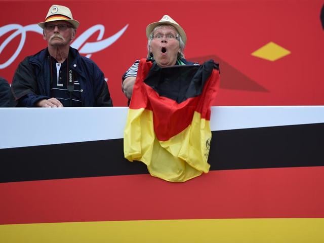 A German supporter reacts while following the match during a public viewing for the first Euro 2016 match of the German national football team against Ukraine in front of the Brandenburger Tor in Berlin, Germany. (AFP Photo) A German supporter reacts while following the match during a public viewing for the first Euro 2016 match of the German national football team against Ukraine in front of the Brandenburger Tor in Berlin, Germany. (AFP Photo)