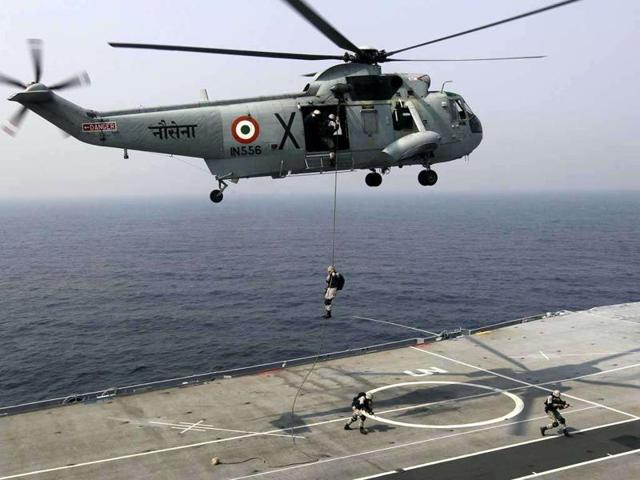 Marine commandoes of the India Navy slither down from a Sea King helicopter during an exercise on board INS Vrat vessel. (FilePhoto) Marine commandoes of the India Navy slither down from a Sea King helicopter during an exercise on board INS Vrat vessel. (FilePhoto)