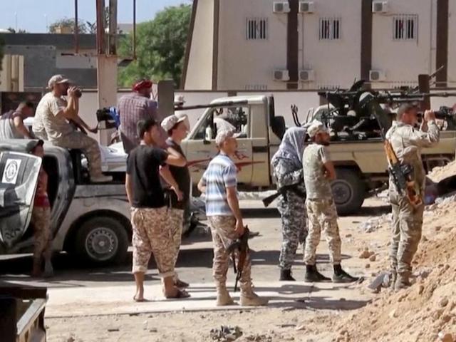 This image Tuesday, June 14, 2016 made from Associated Press video shows, Armed Misrata fighters loyal to the unity government on the main street of Sirte.(AP)
