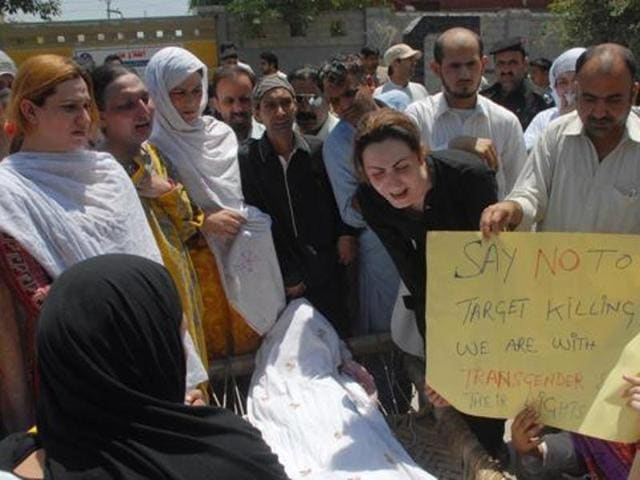 Pakistani transgender Paro (right) mourns the death of her colleague Alesha in Peshawar on May 25. Alesha was shot several times, allegedly by her boyfriend, who was later arrested. She died of her wounds three days after being admitted to hospital. Her friends said she was neglected by doctors and medical professionals, who taunted her, rather than treating her. (AP)