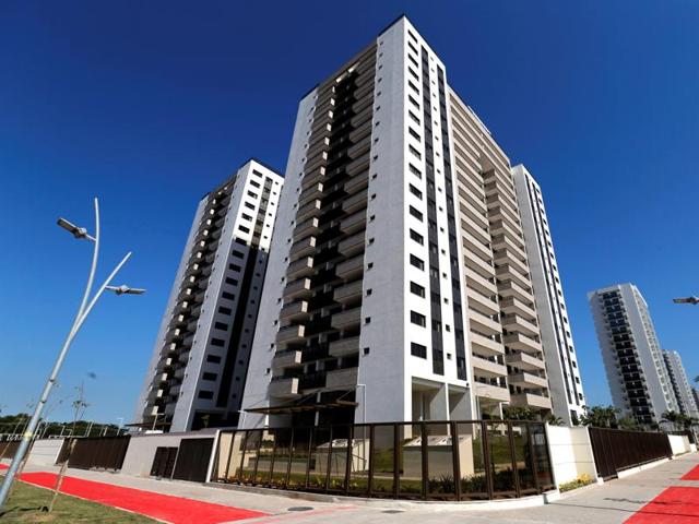 Workers click a selfie at the Olympic Village in Rio de Janeiro, Brazil.(Reuters Photo)