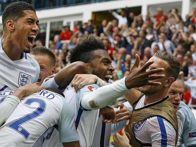 England's Daniel Sturridge, centre, celebrates after scoring his side’s second goal during the Euro 2016 Group B match against Wales at the Bollaert stadium in Lens, France, on June 16, 2016. (AP)