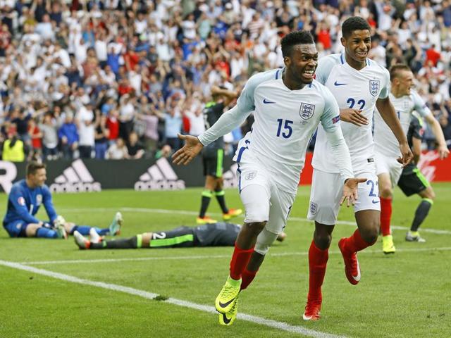Sturridge and teammates Marcus Rashford and Jamie Vardy, right, join in the celebrations. (AP)