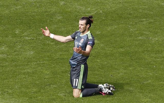 Bale gestures after being brought down by a tackle. (AP) Bale gestures after being brought down by a tackle. (AP)