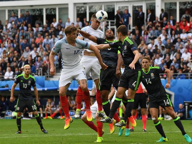 England's Gary Cahill, centre, heads the ball. (AP)