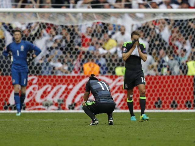 Wales players disappointed at the end of the match. (AP)