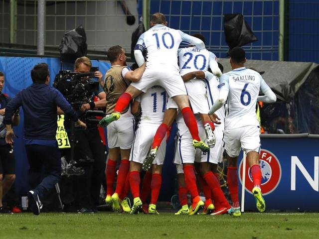 England's players celebrate the winner from Sturridge. (AP)