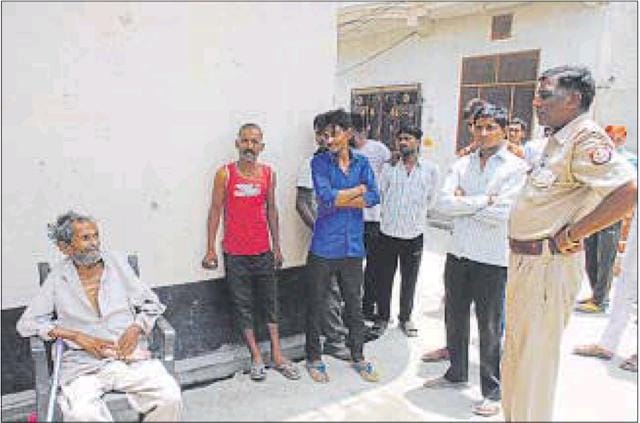 Neighbours and police outside the house(HT photo)