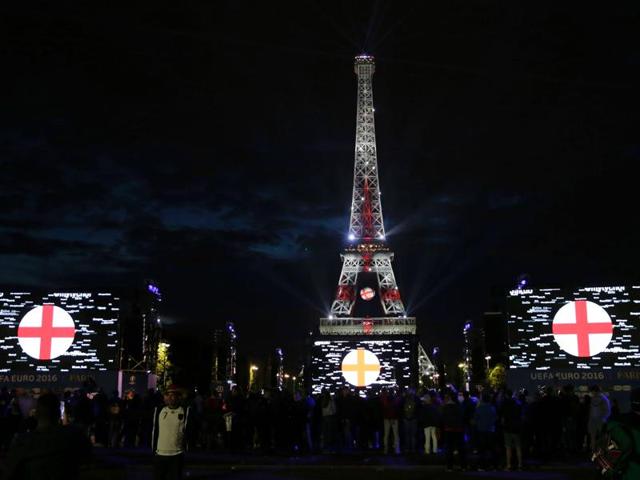 The Eiffel Tower is lit with the colours of England's flag, as seen from the fan zone after the showing of the Euro 2016 group C football match between Germany and Poland. (AFP photo) The Eiffel Tower is lit with the colours of England's flag, as seen from the fan zone after the showing of the Euro 2016 group C football match between Germany and Poland. (AFP photo)