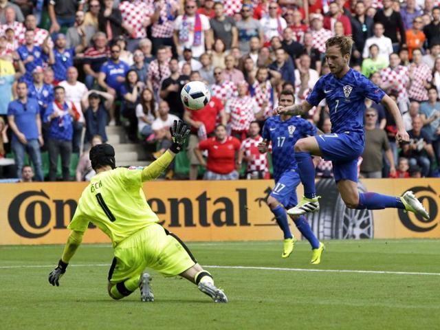 Croatia's Ivan Rakitic, right, chips over Petr Cech to score his side’s second goal. (AP)
