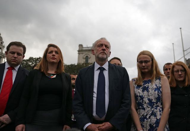 Labour leader Jeremy Corbyn (C) stands amongst colleagues as he attends a vigil to slain Labour MP Jo Cox in Parliament square in London. (AFP) Labour leader Jeremy Corbyn (C) stands amongst colleagues as he attends a vigil to slain Labour MP Jo Cox in Parliament square in London. (AFP)