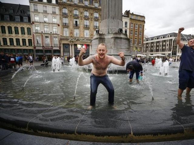 England fans celebrate their team's win in a fountain in Lille. (Reuters photo) England fans celebrate their team's win in a fountain in Lille. (Reuters photo)