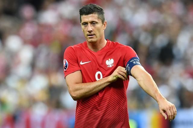 Poland's forward Robert Lewandowski adjusts his arm band during the Euro 2016 group C football match. (AFP Photo) Poland's forward Robert Lewandowski adjusts his arm band during the Euro 2016 group C football match. (AFP Photo)