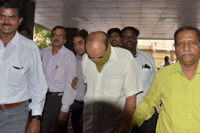 Virendra Tawade (face covered) being taken to the CBI office in CBD Belapur, Navi Mumbai, on Thursday. (Bachchan Kumar) Virendra Tawade (face covered) being taken to the CBI office in CBD Belapur, Navi Mumbai, on Thursday. (Bachchan Kumar)