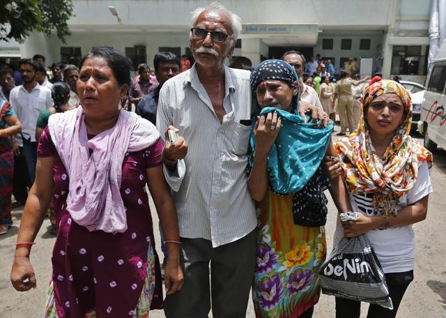 Relatives of a convict in the 2002 Gujarat riots case react after the court announced the lengths of the sentences in Ahmadabad. (AP)