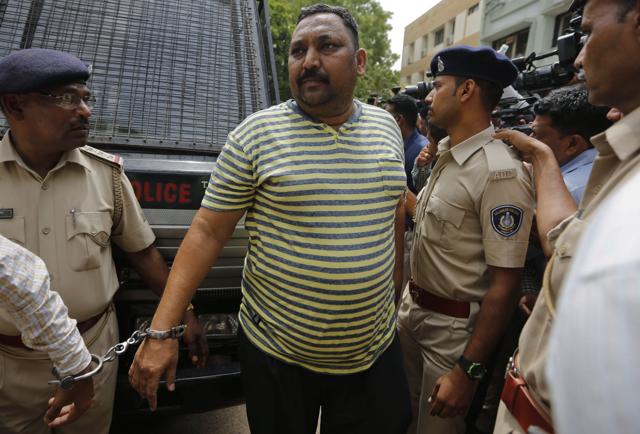 A man convicted for the 2002 Gujarat riots is brought to court in Ahmadabad. (AP)