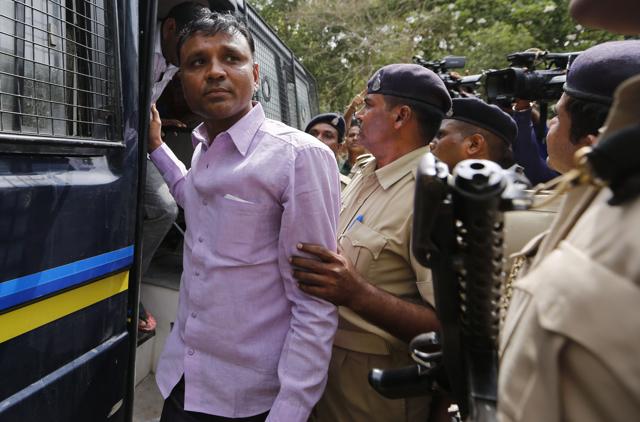 Man convicted for the 2002 Gujarat riots is brought to court in Ahmadabad. (AP)