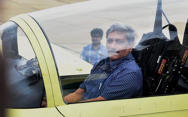 Union defence minister Manohar Parikkar sitting inside the cockpit during the inaugural flight of HTT-40. (PTI Photo) Union defence minister Manohar Parikkar sitting inside the cockpit during the inaugural flight of HTT-40. (PTI Photo)