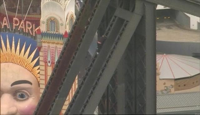 He climbs on of the pillars to the arch of the Sydney Harbour Bridge. (REUTERS)