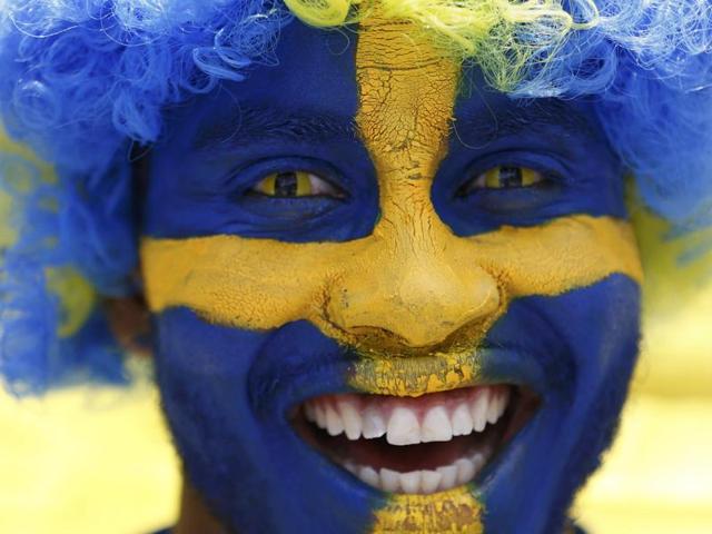 A Sweden fan heads to the stadium in Toulouse for the Group E game against Italy. (Reuters Photo)