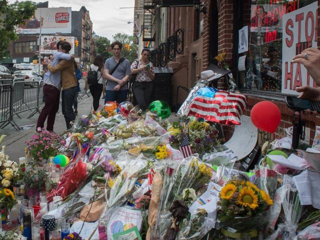 Visitors embrace near a memorial for the Orlando shooting victims. Omar Mateen, an American of Afghani descent opened fire at a gay club in Orlando on June 12, killing 49 people injuring 53 more. (AFP Photo) Visitors embrace near a memorial for the Orlando shooting victims. Omar Mateen, an American of Afghani descent opened fire at a gay club in Orlando on June 12, killing 49 people injuring 53 more. (AFP Photo)