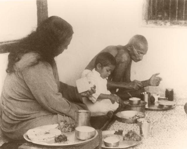 Paramahansa Yogananda shares a meal with Mahatma Gandhi. (Image courtesy Yogoda Satsanga Society of India)