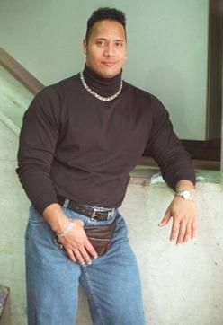 The Rock. In a polo neck. With bling. Looking weird. (Instagram) The Rock. In a polo neck. With bling. Looking weird. (Instagram)
